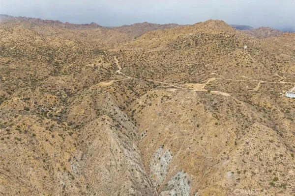 a view of mountains and valleys