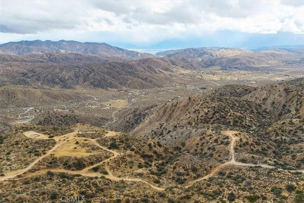 a view of mountain view with mountains in the background