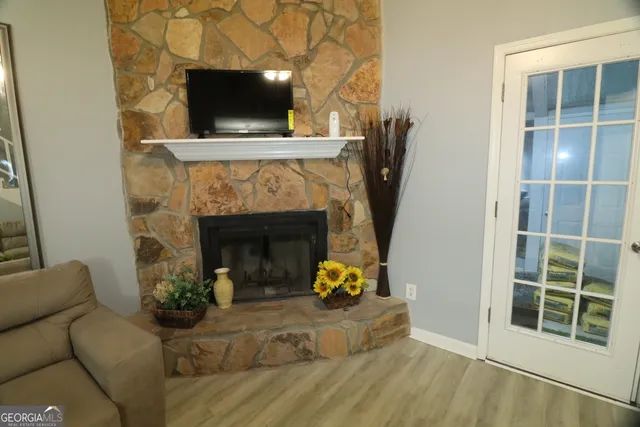 a living room with furniture and a fireplace