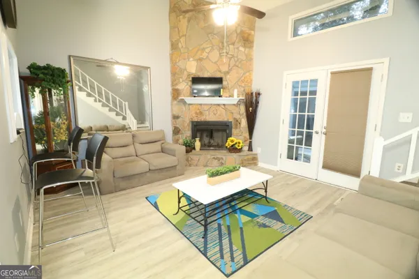 a living room with furniture and a fireplace