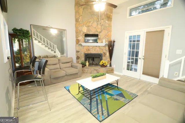 a living room with furniture and a fireplace