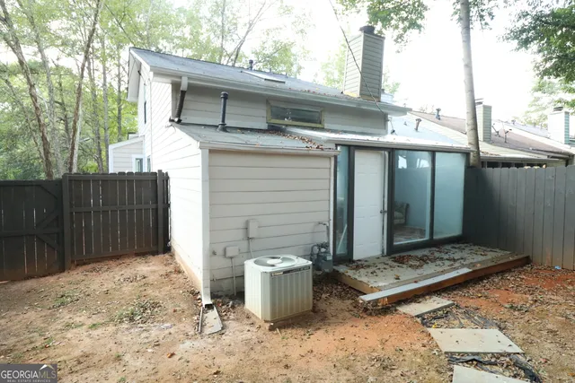 a view of a sink and bench next to a yard