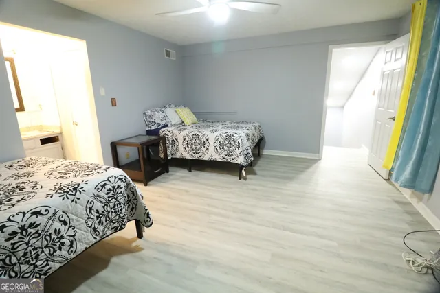 a bedroom with a bed and a dresser