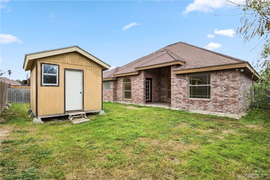 1720 East 2nd Street Weslaco, TX 78596 - Photo 15 of 17 a view of a house with backyard