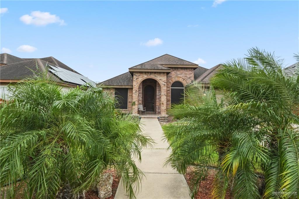 1720 East 2nd Street Weslaco, TX 78596 - Photo 2 of 17 a front view of a house with a yard