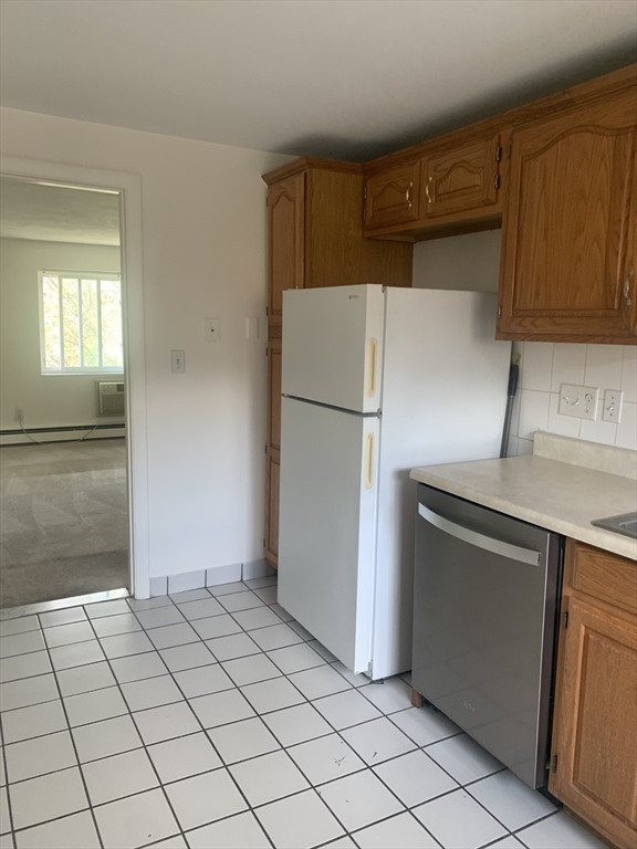 22 Bryon Road, Unit 3 Boston, MA 02467 - Photo 4 of 16 a utility room with cabinets