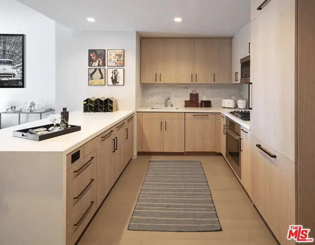 a kitchen with a cabinets and white appliances