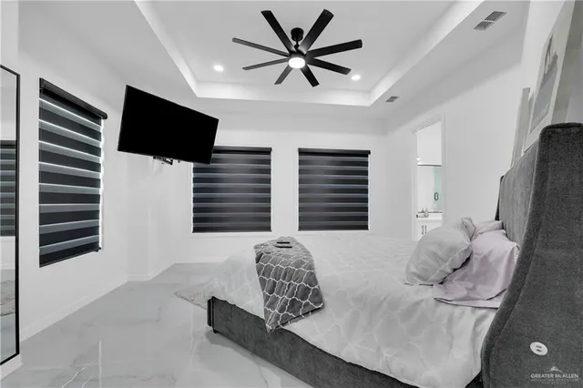 a bedroom with a bed and window