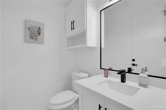 a view of a livingroom with an empty space & a window