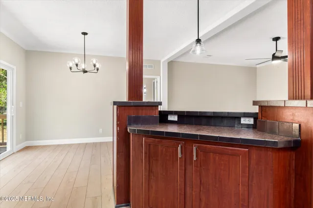 a view of cabinets and wooden floor
