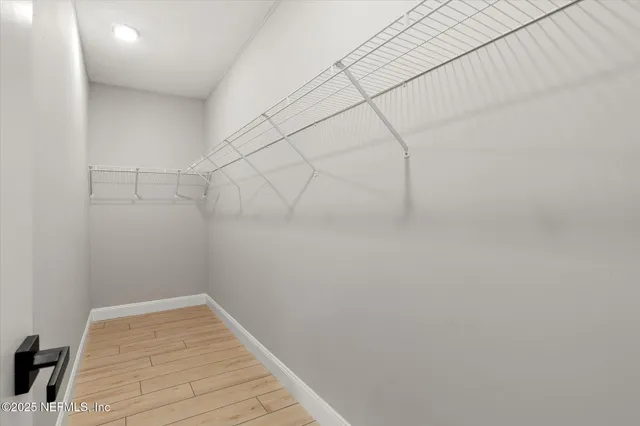 a view of a room with racks on the wall