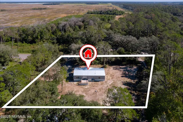 a view of a street with a building in the background