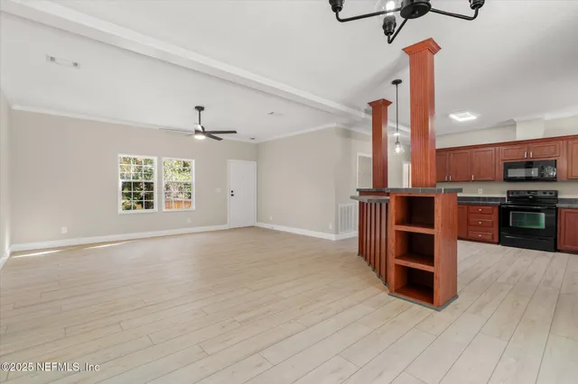a view of kitchen with furniture and window