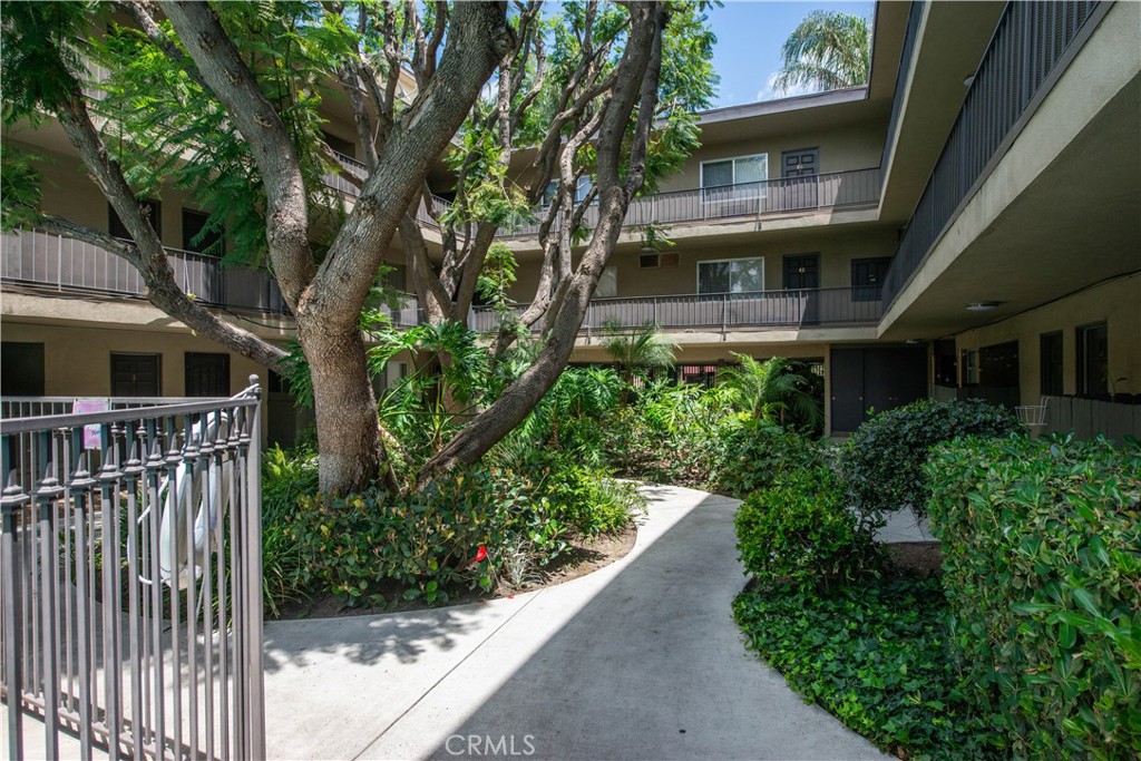 5415 Newcastle Avenue, Unit 18 Encino, CA 91316 - Photo 24 of 25 a view of a house with a small yard