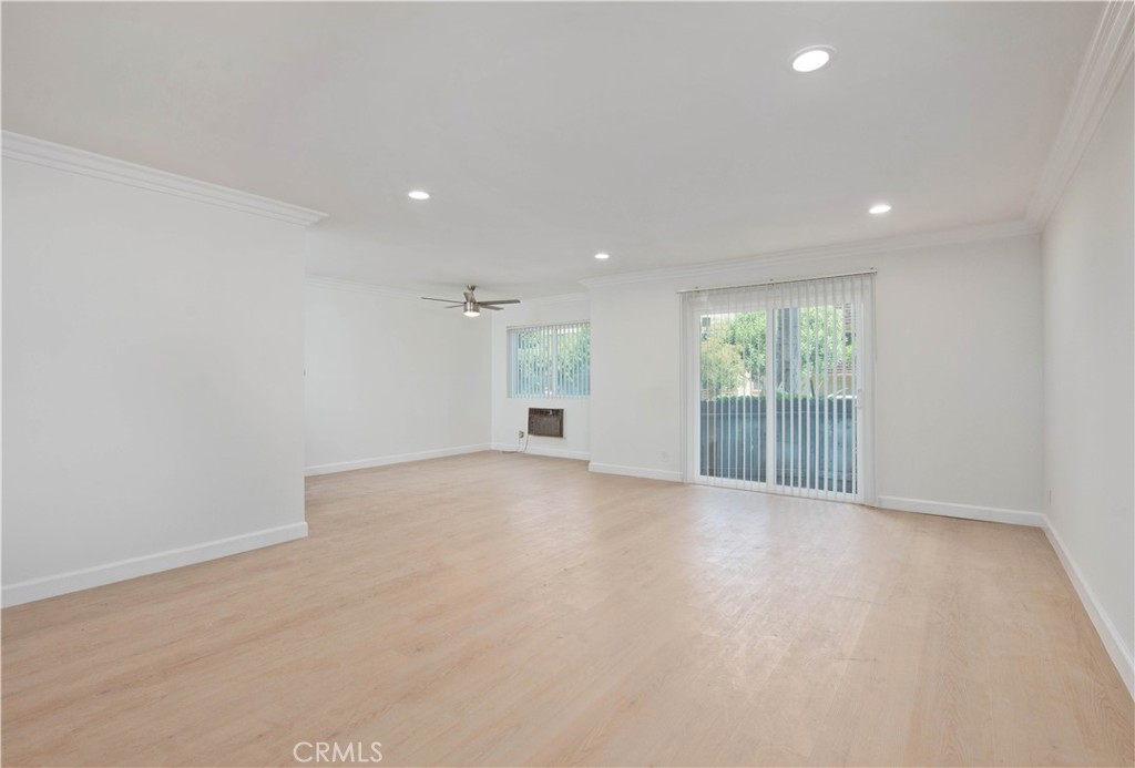 5415 Newcastle Avenue, Unit 18 Encino, CA 91316 - Photo 9 of 25 an empty room with windows