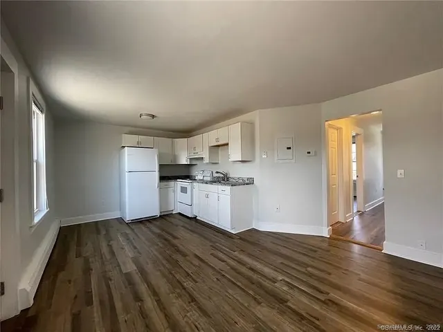 a view of kitchen with wooden floor