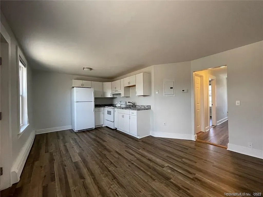 30 Anthony Street, Unit C Griswold, CT 06351 - Photo 3 of 11 a view of kitchen with wooden floor