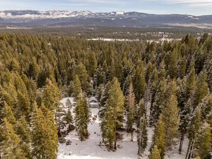 a view of a yard covered in snow