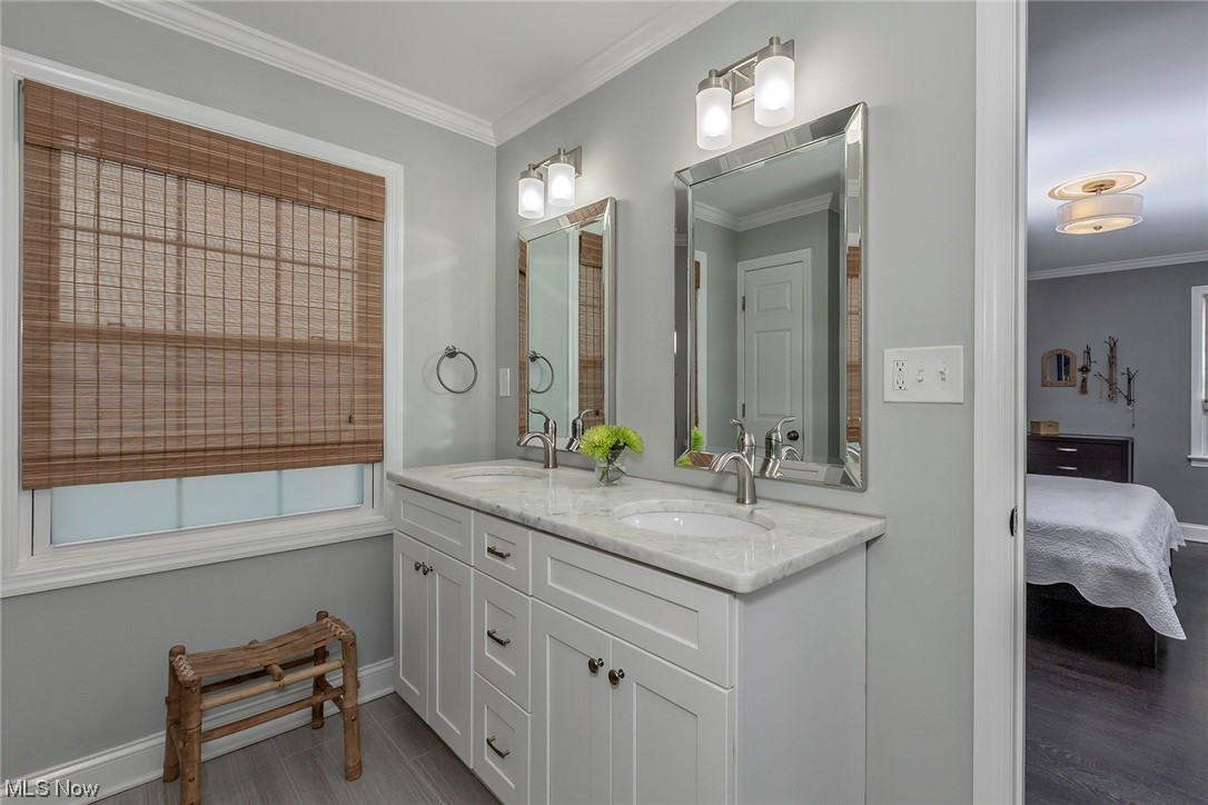 24101 Hazelmere Road Beachwood, OH 44122 - Photo 13 of 25 Dual vanity sinks and linen closet offer extra storage.