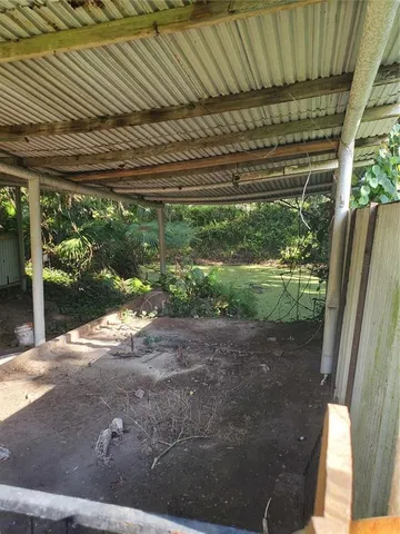 a view of a backyard with a trees