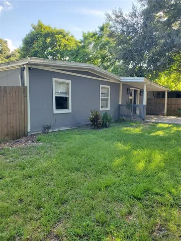 a backyard of a house with seating space