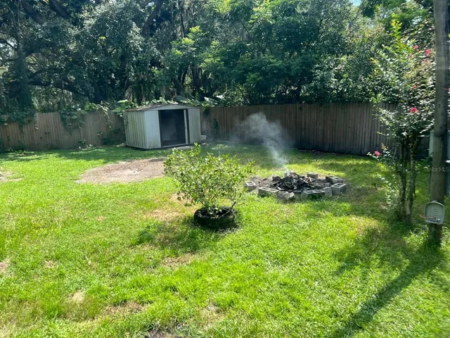a backyard of a house with lots of green space