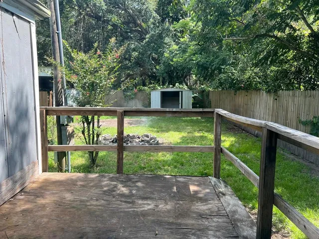 a view of back yard from a balcony