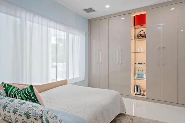 a bathroom with a granite countertop toilet sink and a mirror