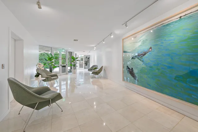 a swimming pool with outdoor seating and yard