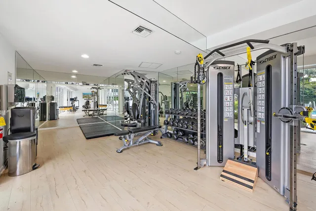 a view of a patio with couches table and chairs and potted plants