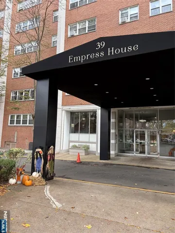 a view of a brick building with many windows