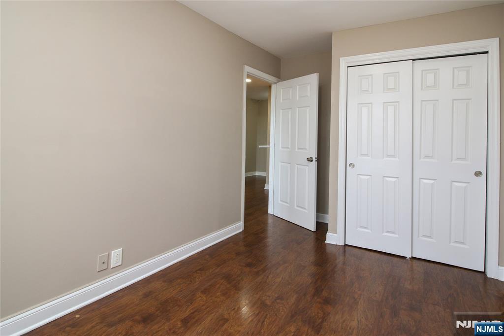 39 East 39th Street, Unit 412 Paterson, NJ 07514 - Photo 21 of 21 a view of an empty room with wooden floor