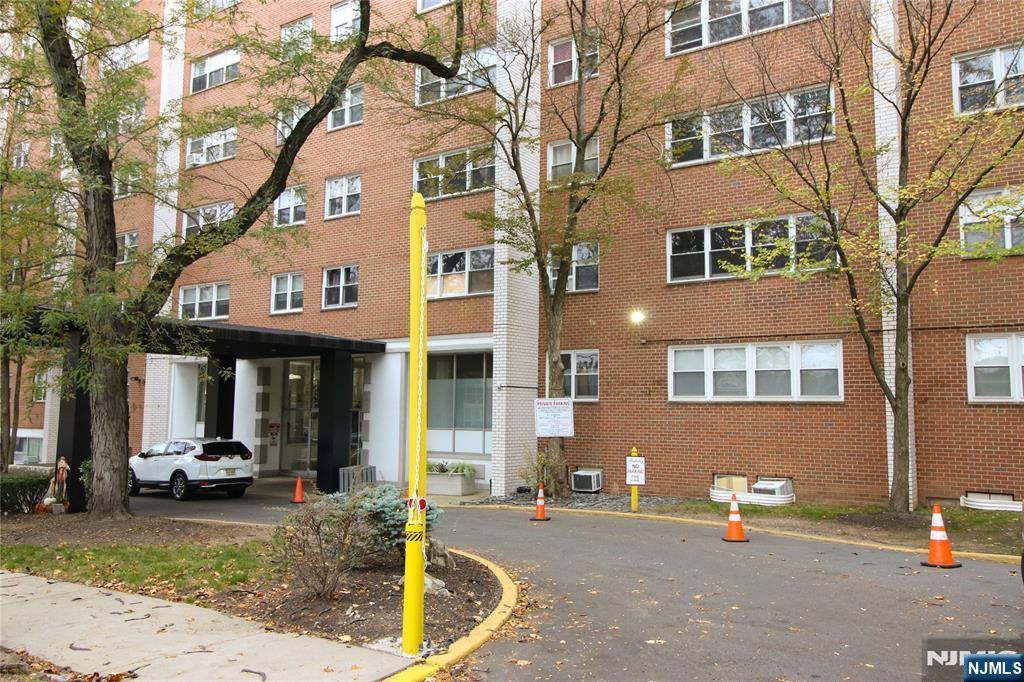 39 East 39th Street, Unit 412 Paterson, NJ 07514 - Photo 3 of 21 a view of a brick building with many windows