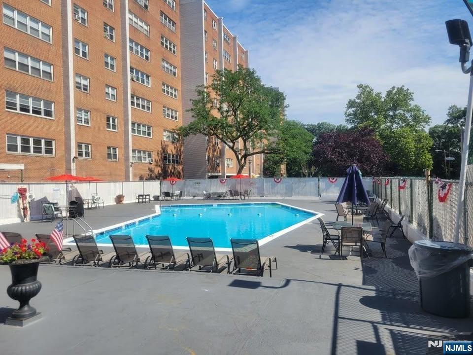 39 East 39th Street, Unit 412 Paterson, NJ 07514 - Photo 7 of 21 a view of outdoor space with seating area and trees