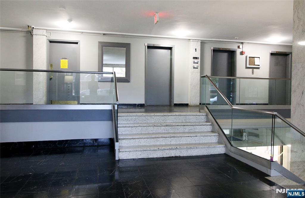 39 East 39th Street, Unit 412 Paterson, NJ 07514 - Photo 8 of 21 a view of entryway and hall with wooden floor