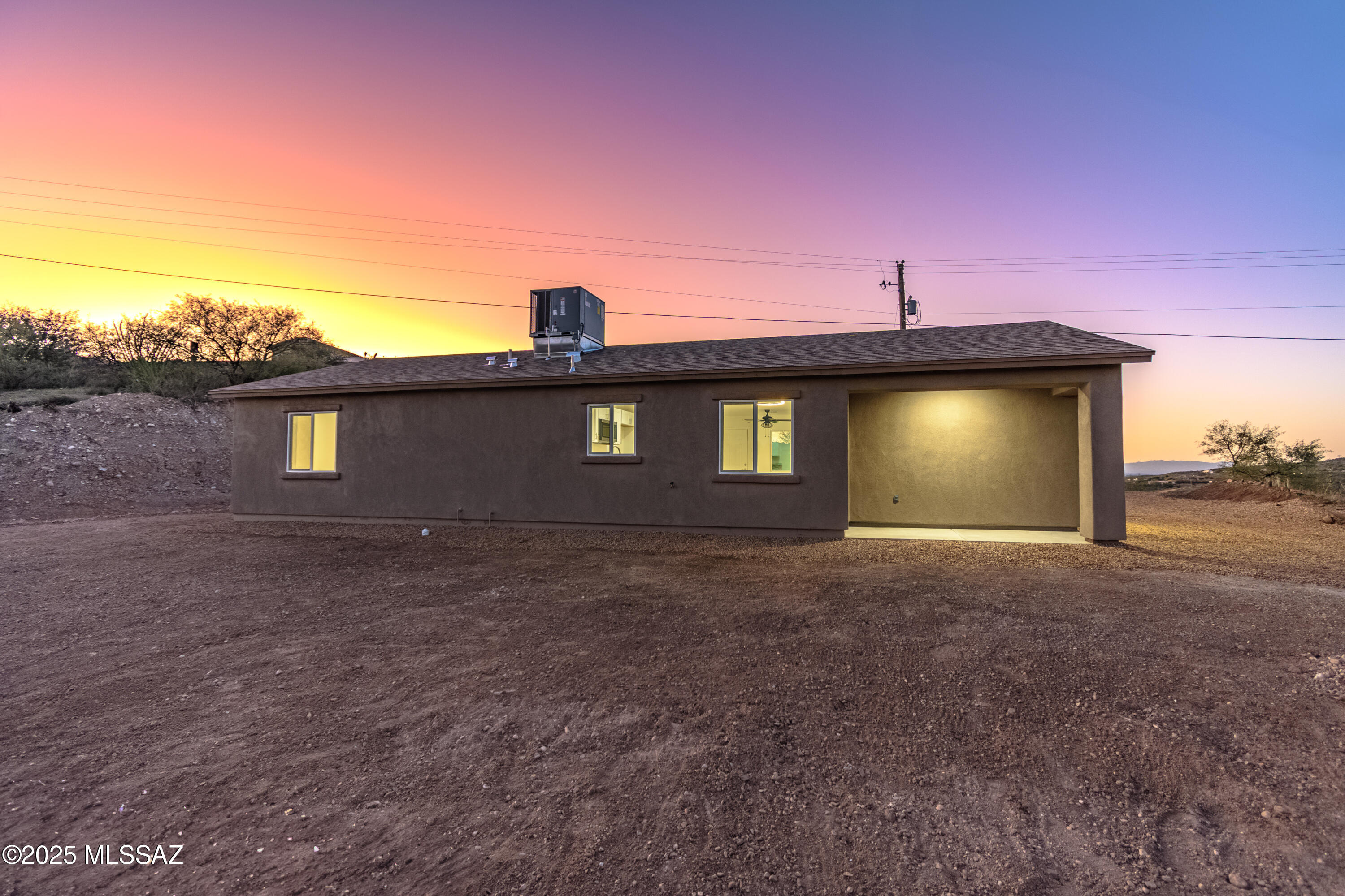 329 Camino Magnifico Rio Rico, AZ 85648 - Photo 43 of 47 a front view of a house with a yard