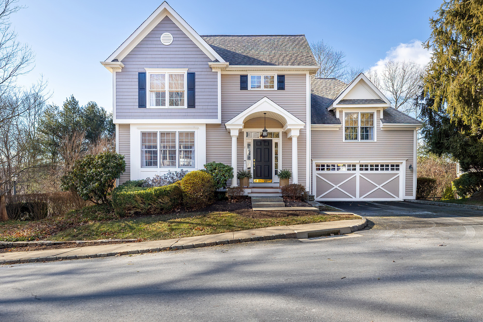 1 Woods Way, Unit 1 Redding, CT 06896 - Photo 1 of 1 a front view of a house with a yard and garage