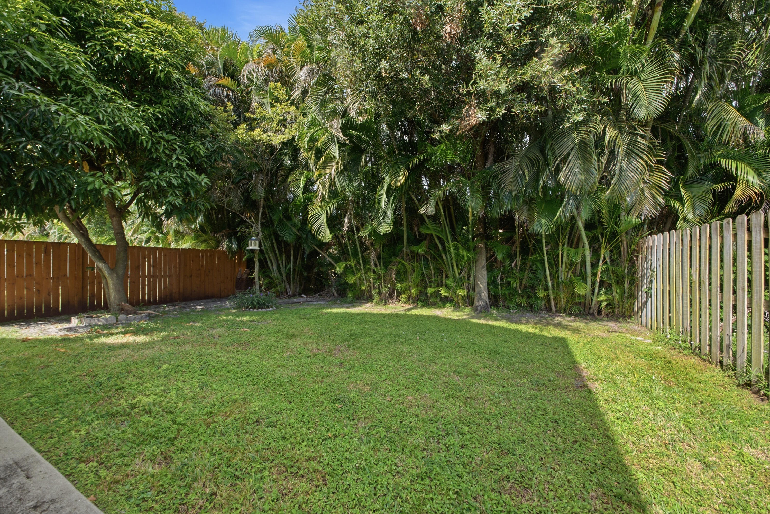 8021 Stirrup Cay Court Boynton Beach, FL 33436 - Photo 23 of 23 a garden with trees in front of it