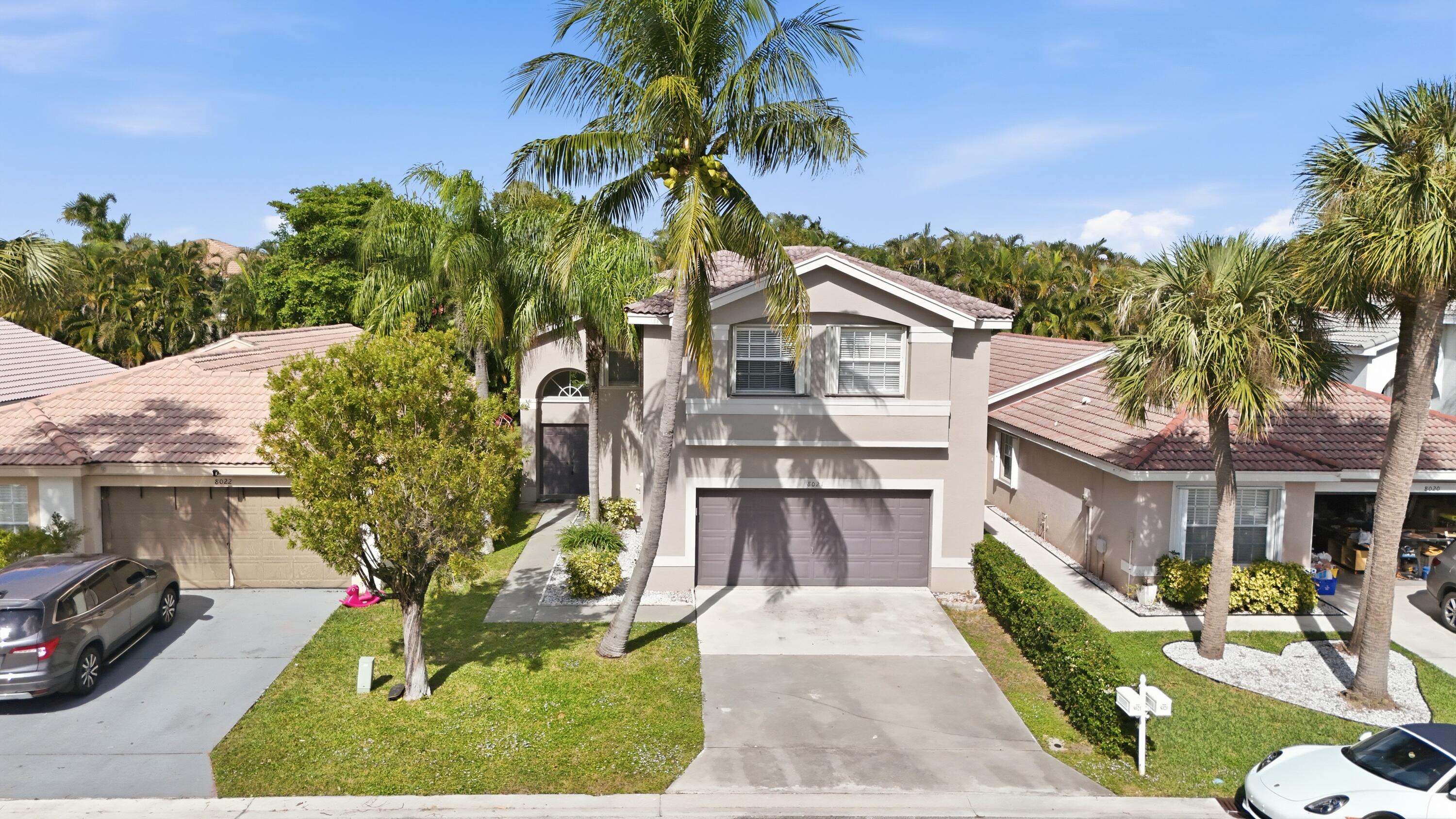 8021 Stirrup Cay Court Boynton Beach, FL 33436 - Photo 3 of 23 a front view of a house with a yard