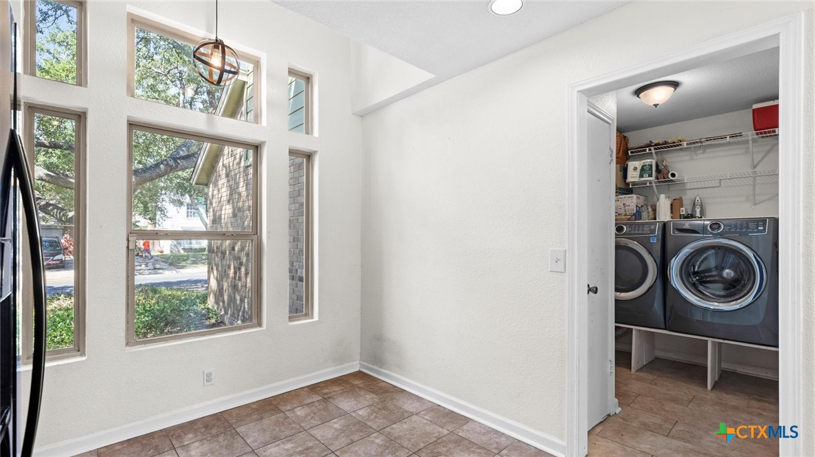 9739 Wagon Train Converse, TX 78109 - Photo 13 of 29 a view of washer and dryer in a room