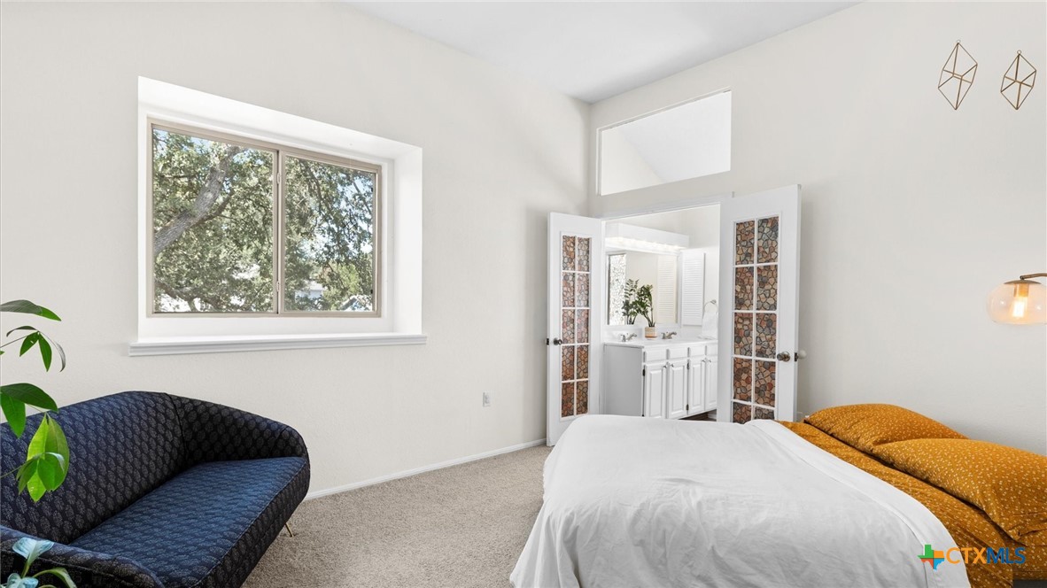 9739 Wagon Train Converse, TX 78109 - Photo 20 of 29 a bedroom with a bed and a window