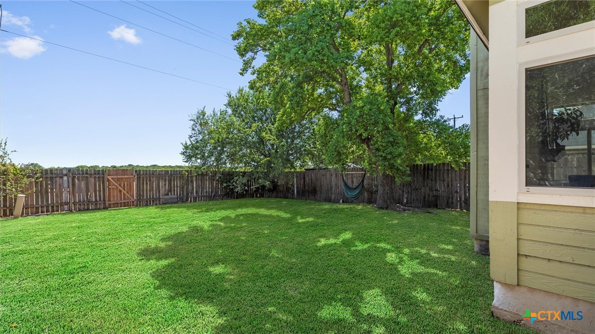 9739 Wagon Train Converse, TX 78109 - Photo 25 of 29 a view of a backyard with a garden