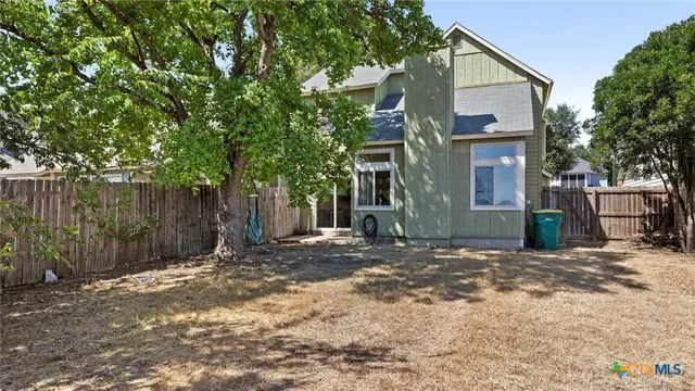 a view of a house with a street