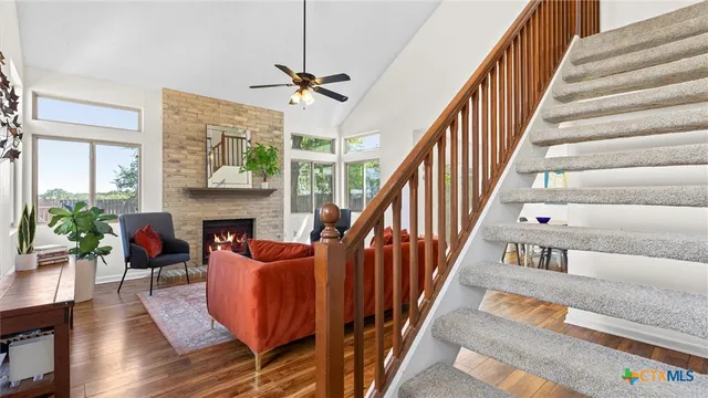 a view of entryway livingroom and hall with wooden floor