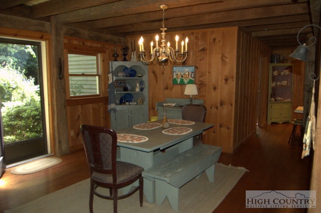 123 John Griffith Road Lansing, NC 28643 - Photo 19 of 21 a view of a dining room with furniture and chandelier