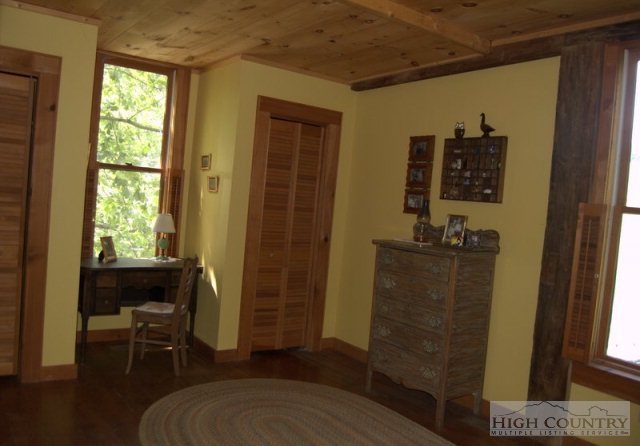 123 John Griffith Road Lansing, NC 28643 - Photo 6 of 21 a bedroom with a bed and a window