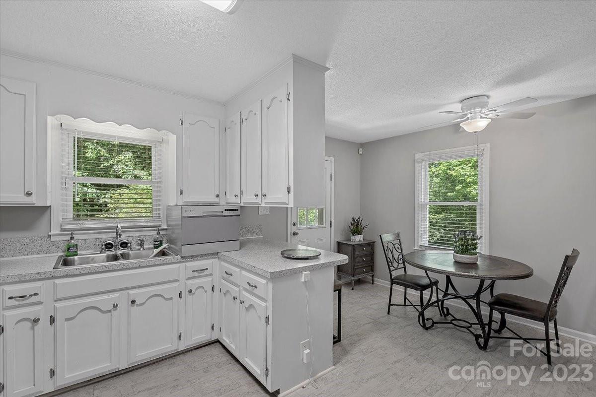 1525 Reservation Road Rock Hill, SC 29730 - Photo 5 of 31 a kitchen that has a sink and chairs