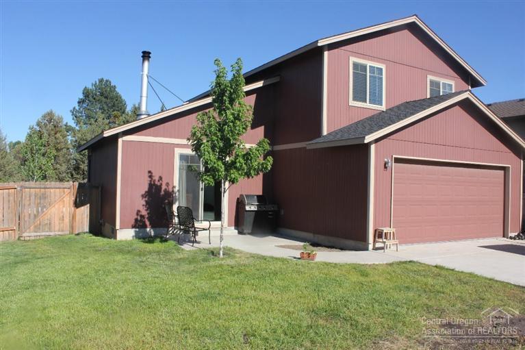 63263 Vogt Road Bend, OR 97701 - Photo 13 of 16 a front view of house with a garden