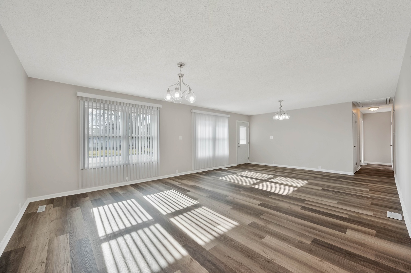 2 Concord Avenue Romeoville, IL 60446 - Photo 6 of 15 a view of an empty room with wooden floor and a window