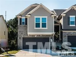 a front view of a house with yard